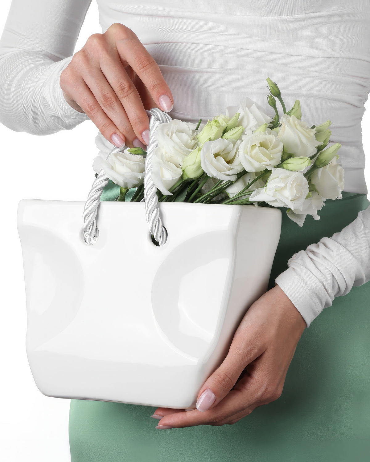 White ceramic handbag vase with rope handles filled with white roses — wholesale box of 10