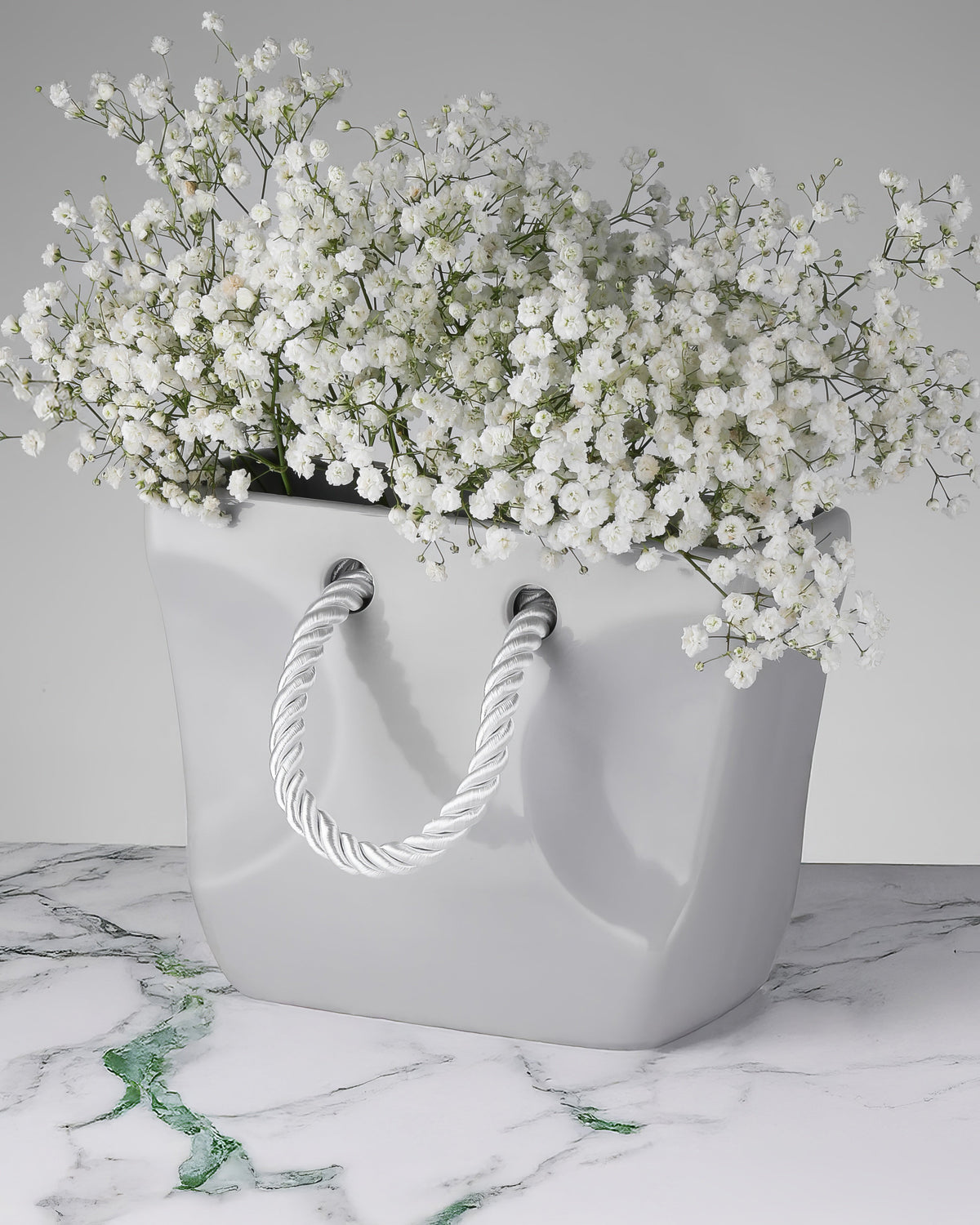Stone-grey ceramic purse vase with twisted rope handles