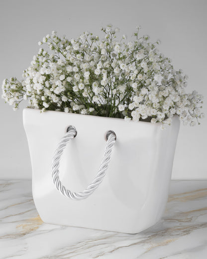 White ceramic handbag vase size 8.7 inches wide and 6.5 inches tall