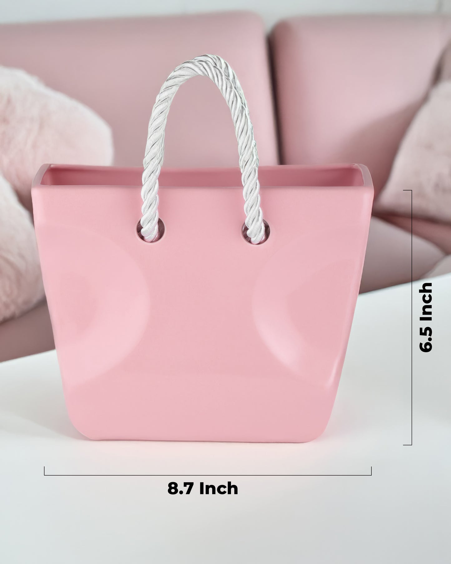 Pink ceramic handbag vase filled with fresh flowers, blush coquette decor piece