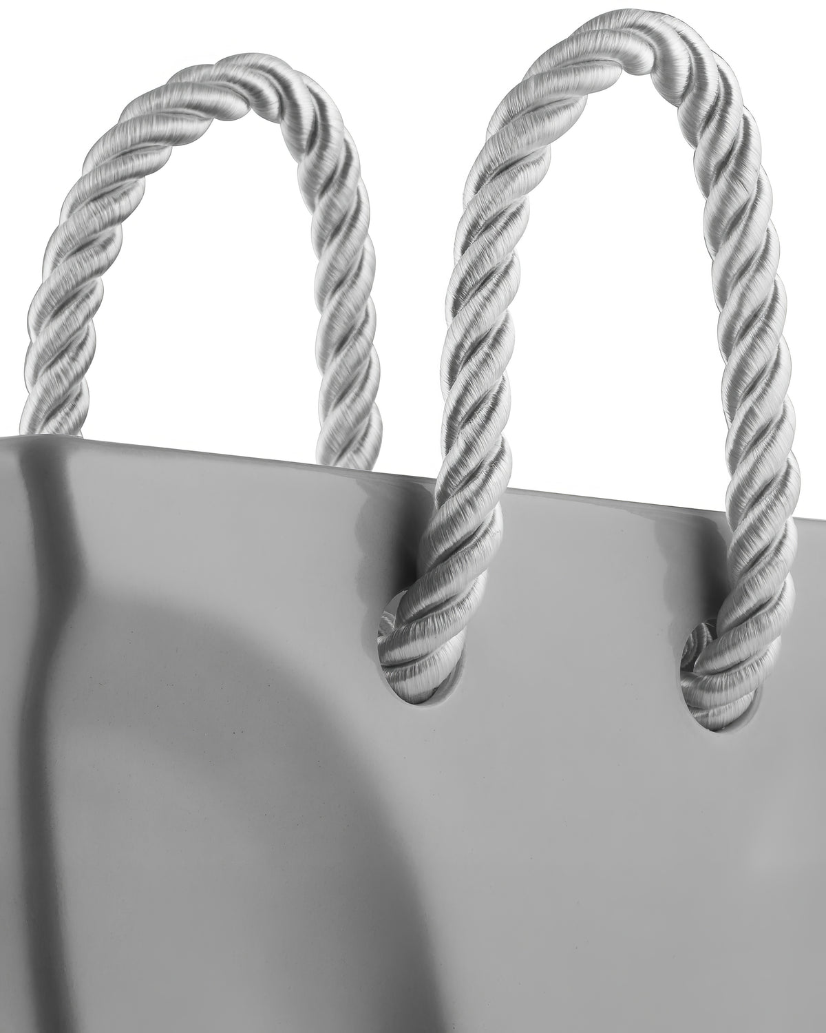 Top-down view of an empty gray ceramic handbag vase, minimalist tote bag flower vase